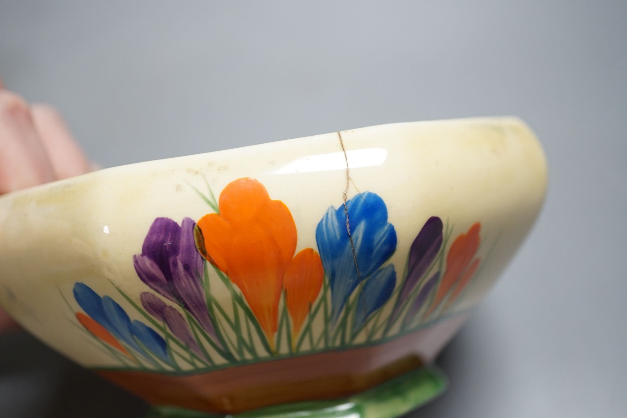 A Clarice Cliff Fantasque vase and two other Clarice cliff items